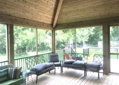 covered wood flooring patio with furniture