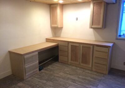 stained wood kitchen cabinets, wood flooring, kitchen lights