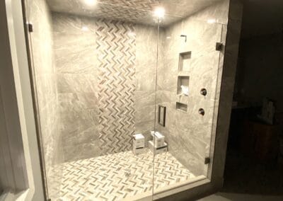 Marble shower room with glass doors