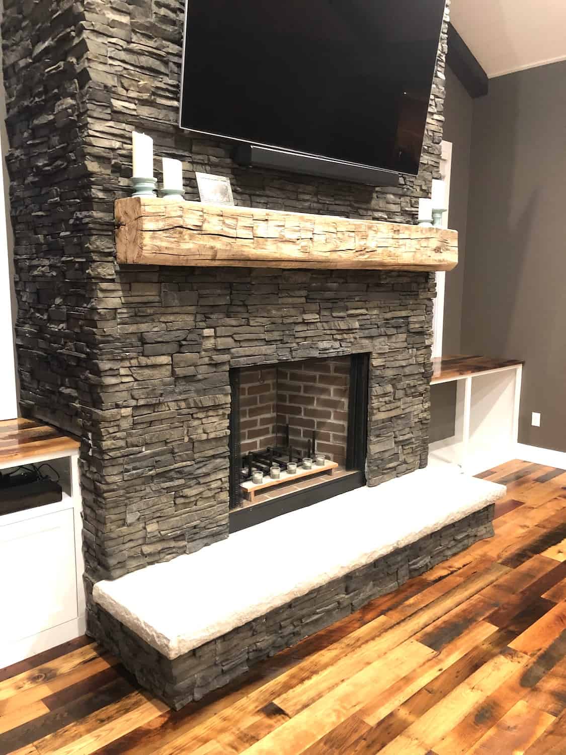 custom fire place with wood flooring