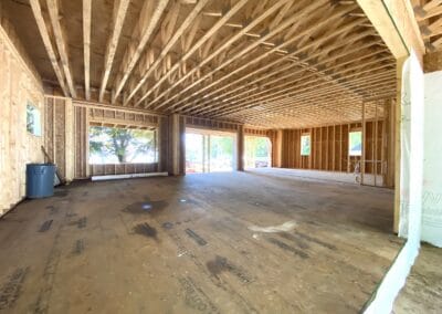 under construction wide space, wood flooring, wood ceiling frames